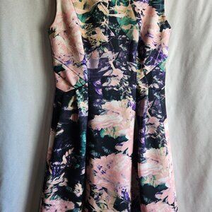 Carmen dress, size 4. Floral pattern, pink, purple, green and blue.